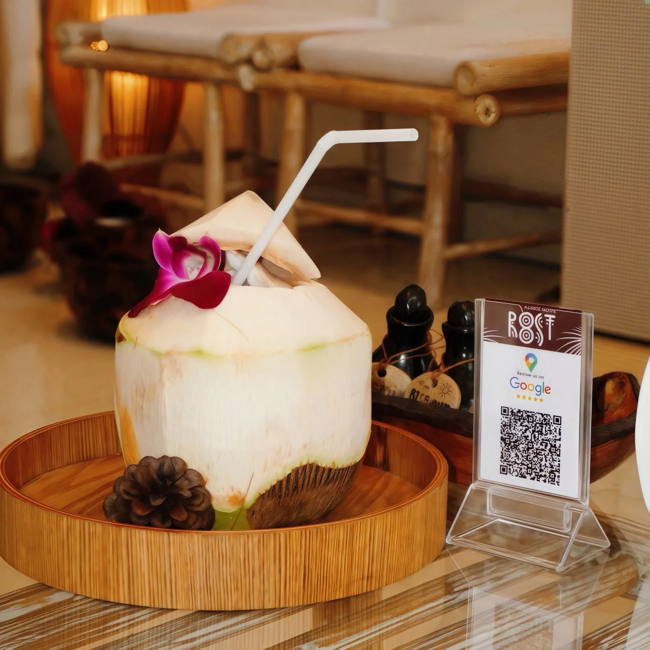 Signature coconut welcome drink with orchid