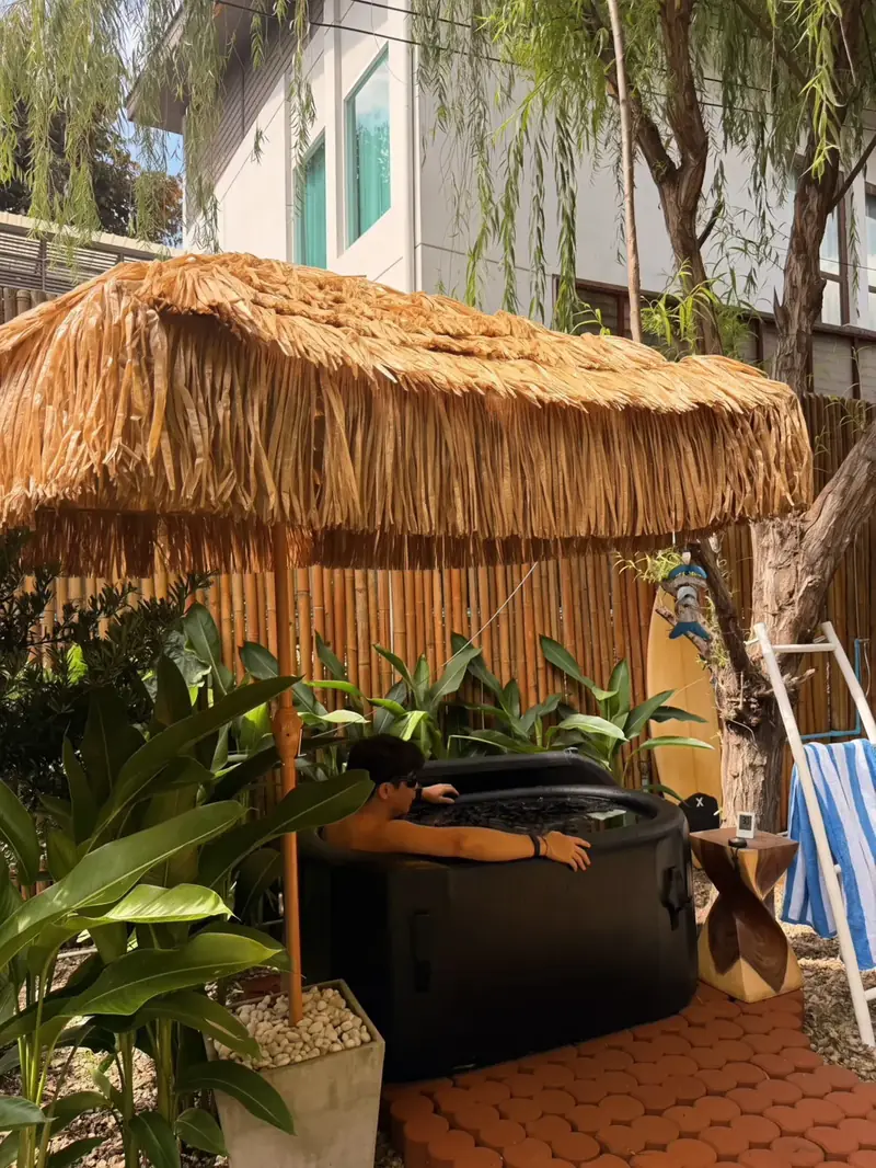 Ice bath under a thatched umbrella at R8ST Wat Ket